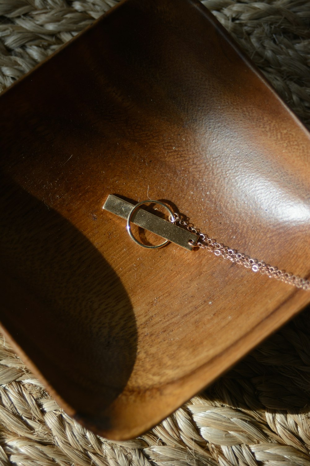 silver-colored pendant on plate