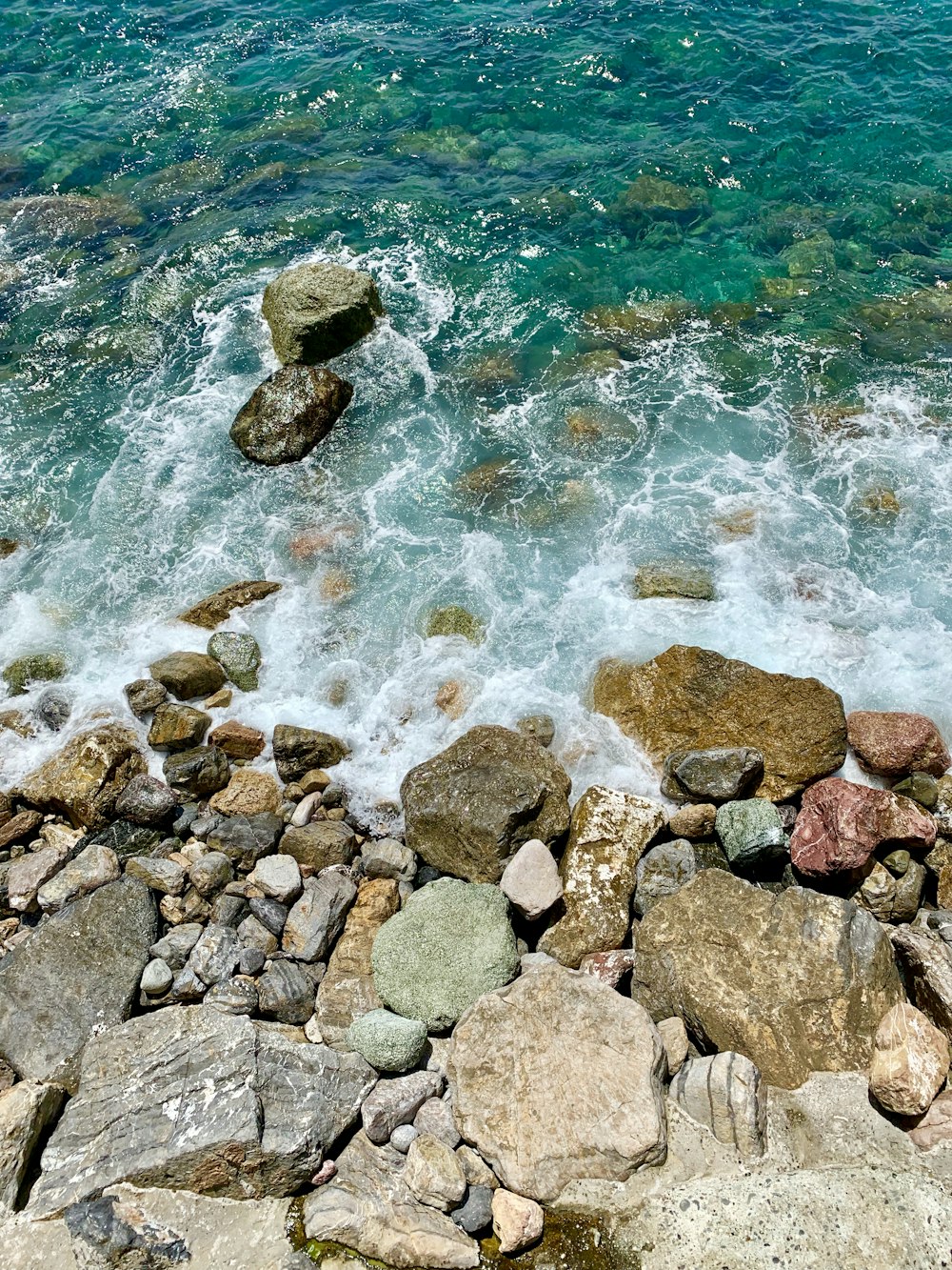 rick formation near body of water during daytime