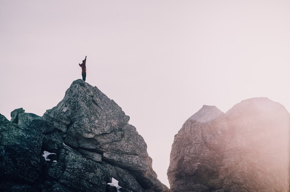 person standing on rock