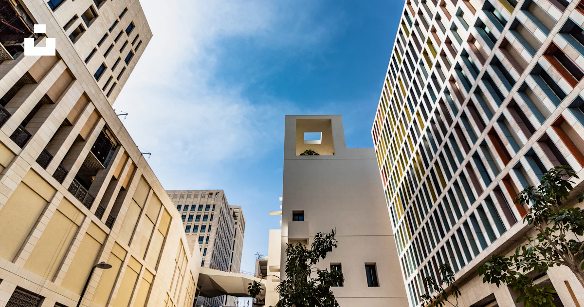 Architectural photo of beige buildings photo – Free Blue Image on Unsplash