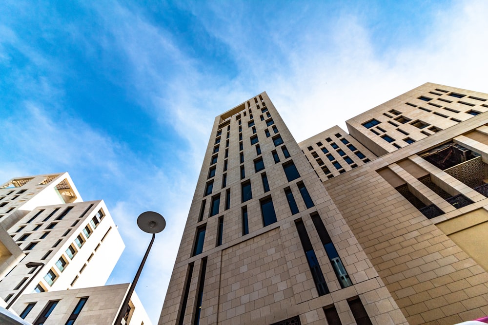 low angle view photography of brown buildings