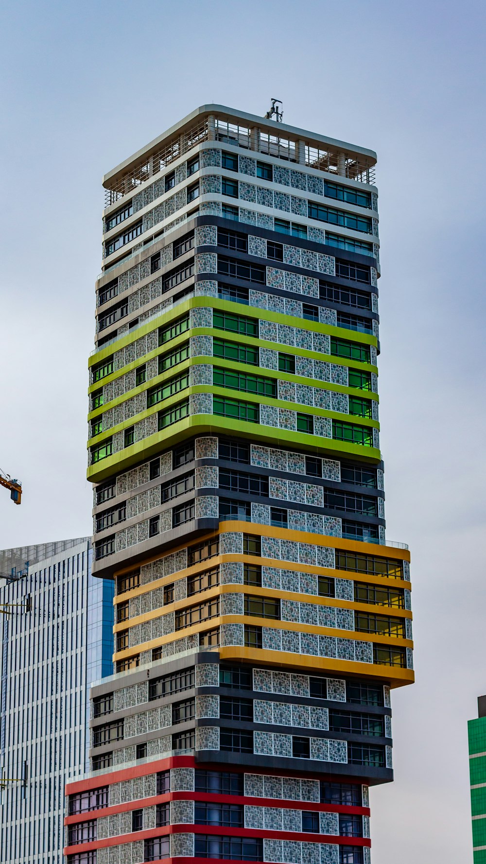 gray, red, yellow and green high-rise building