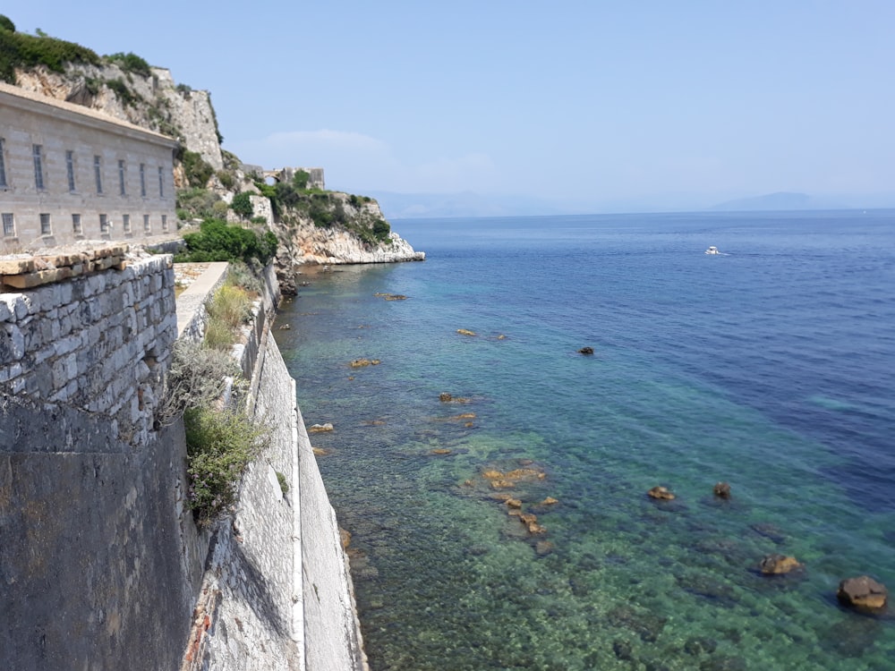 concrete building beside sea