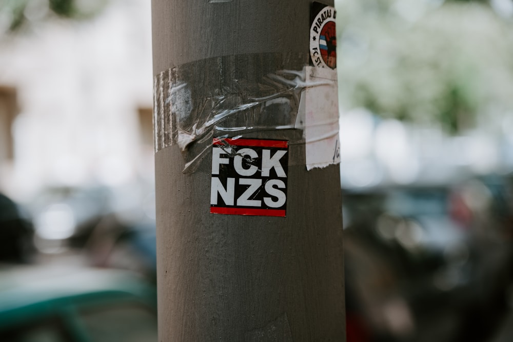 FCK NZS sticker on pole