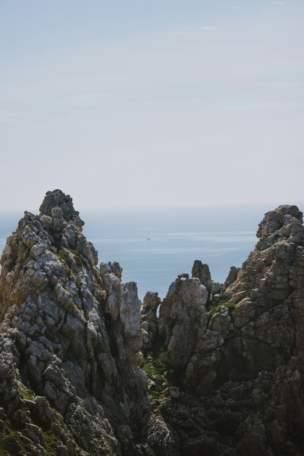 gray rock formation beside sea
