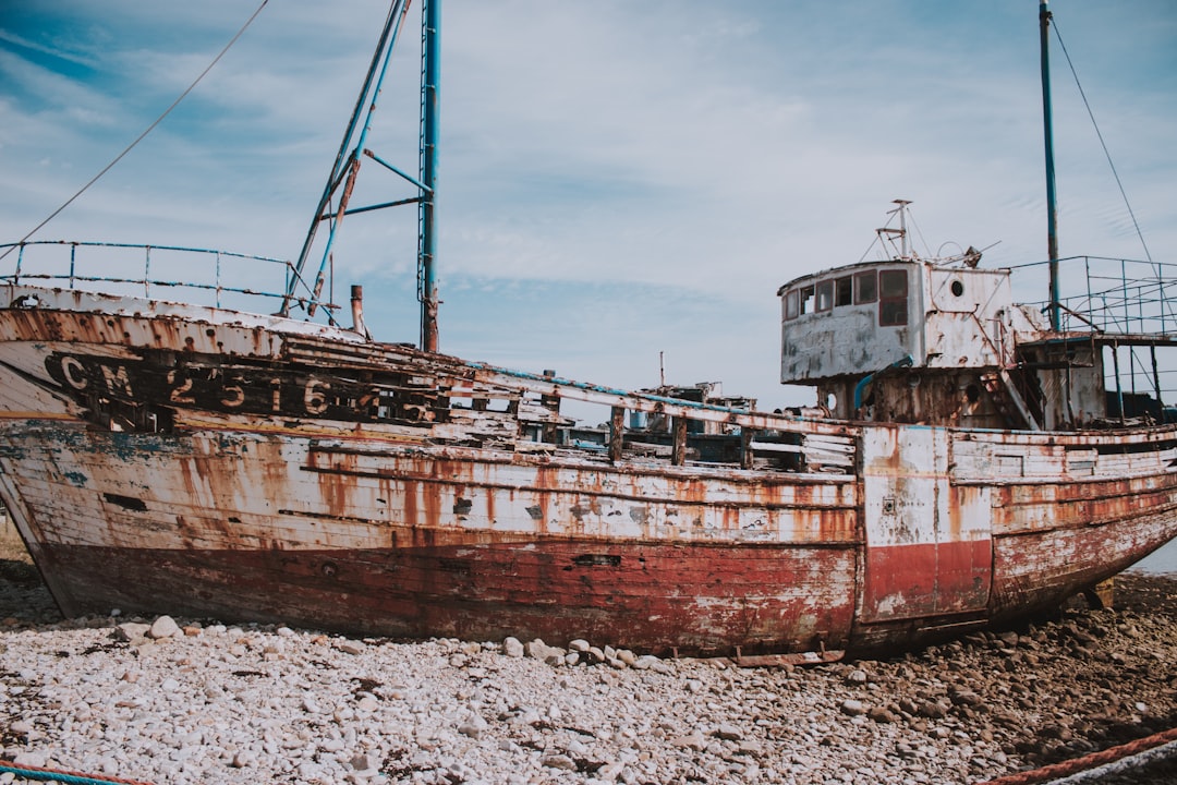 white and red fishing boat