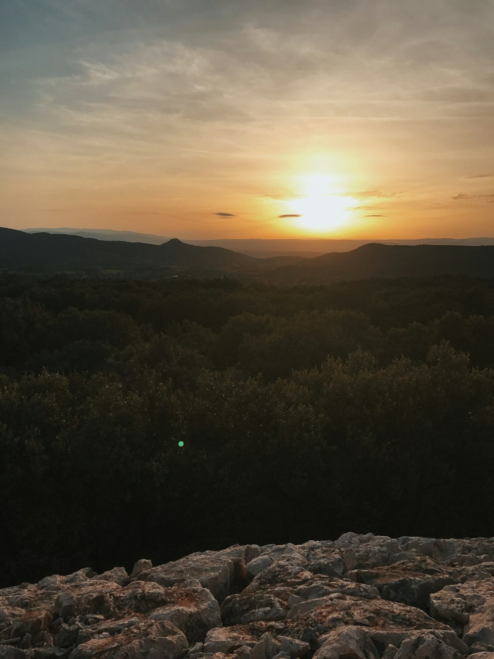 high-angle photography of cliff mountain under gray sky