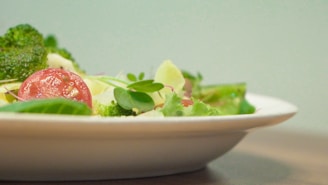 A close-up of a healthy meal featuring fresh vegetables and whole grains, symbolizing balanced nutrition.