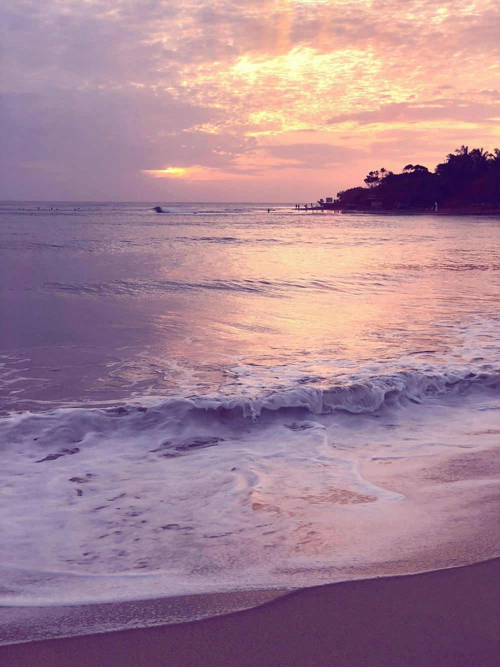 blue beach under gray sky