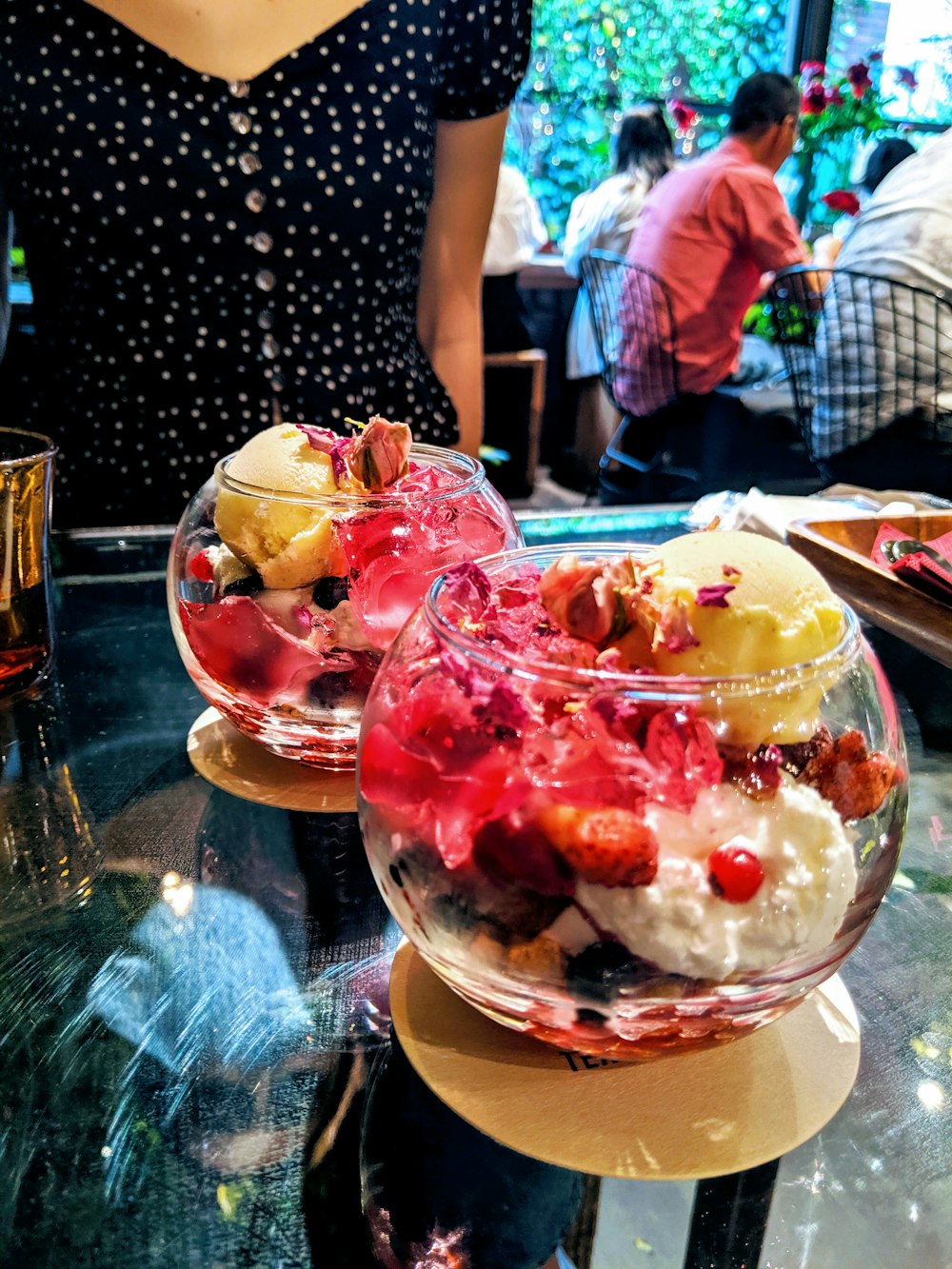 two ice creams on clear glass cups