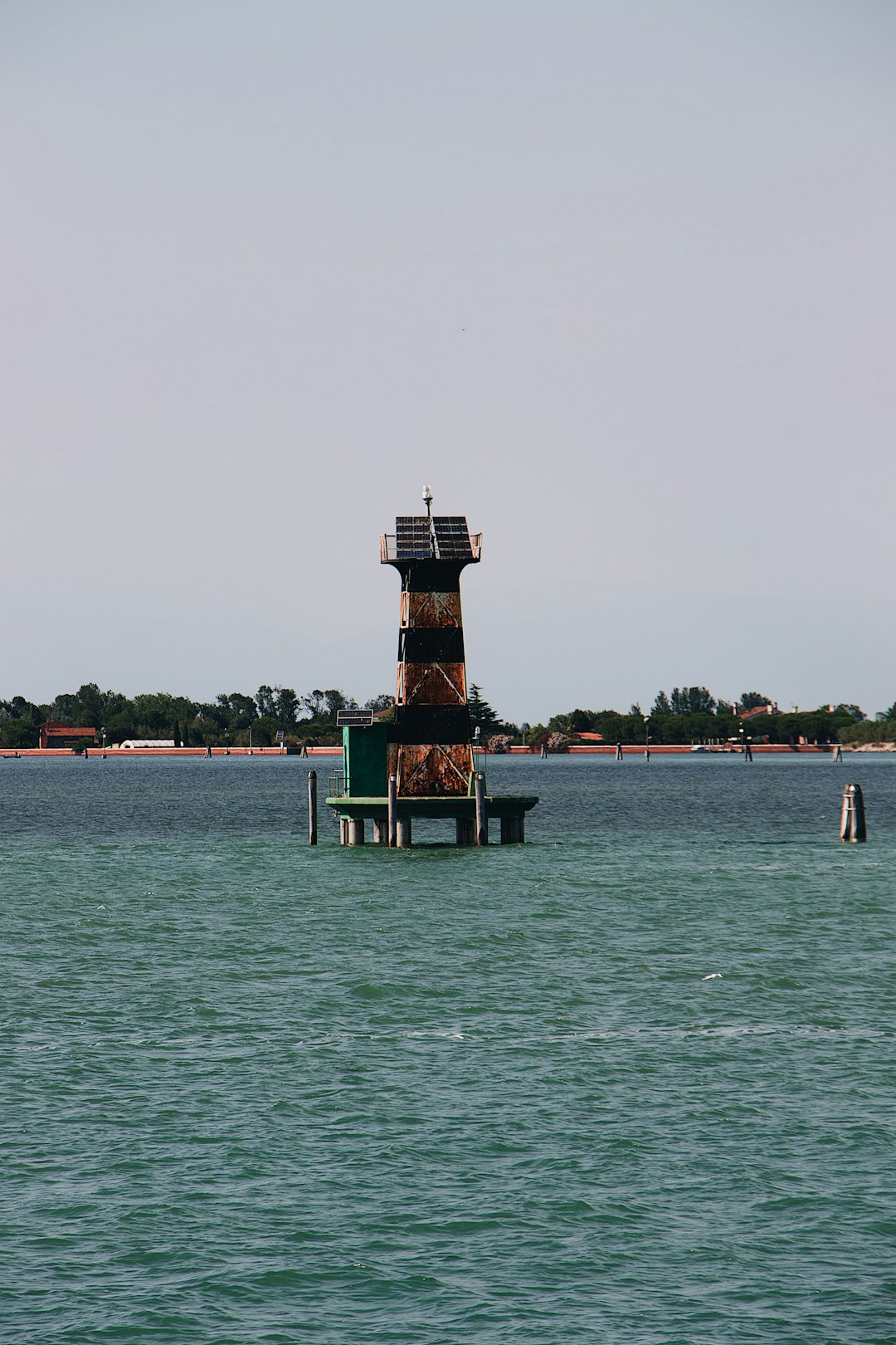 lighthouse in the middle of water