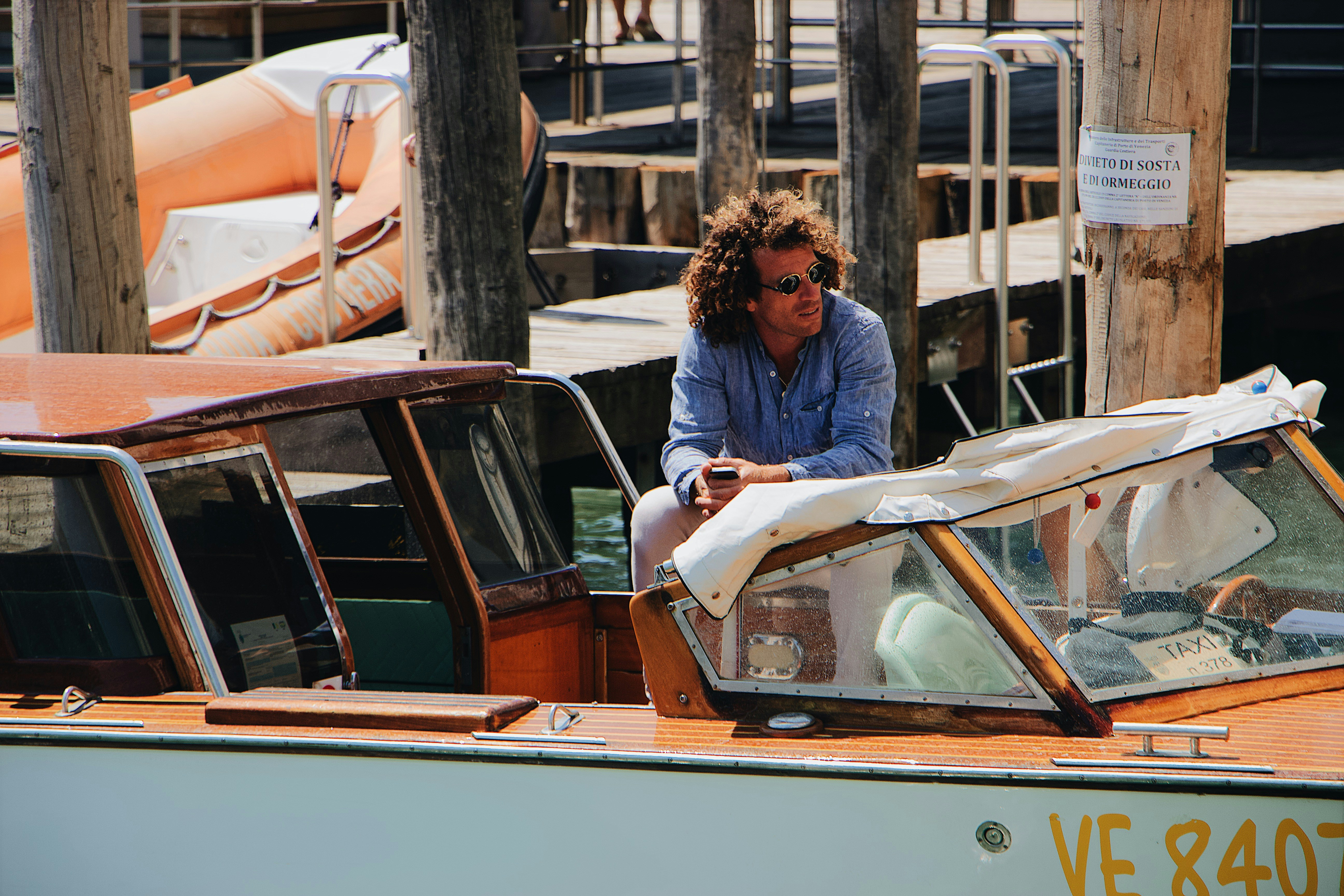 man in white and orange powerboat
