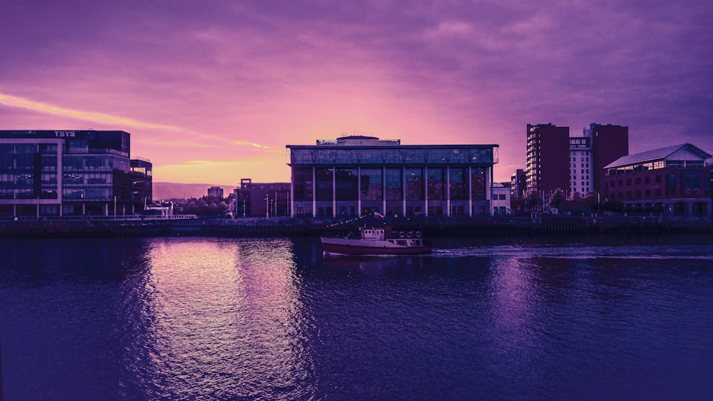 calm body of water near building during daytime