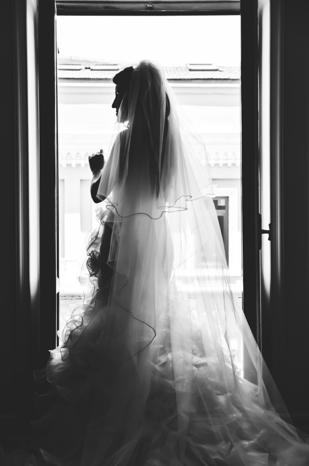 grayscale photography of woman wearing wedding dress