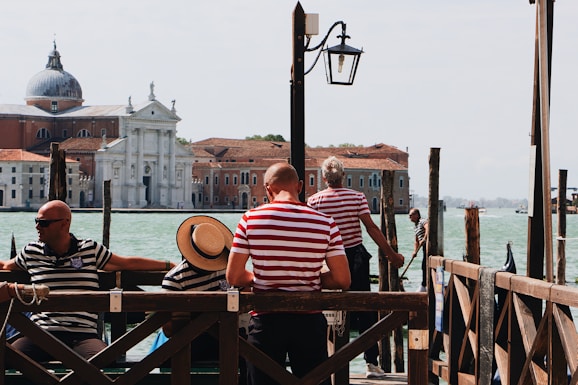 gondoliers resting under clear sky