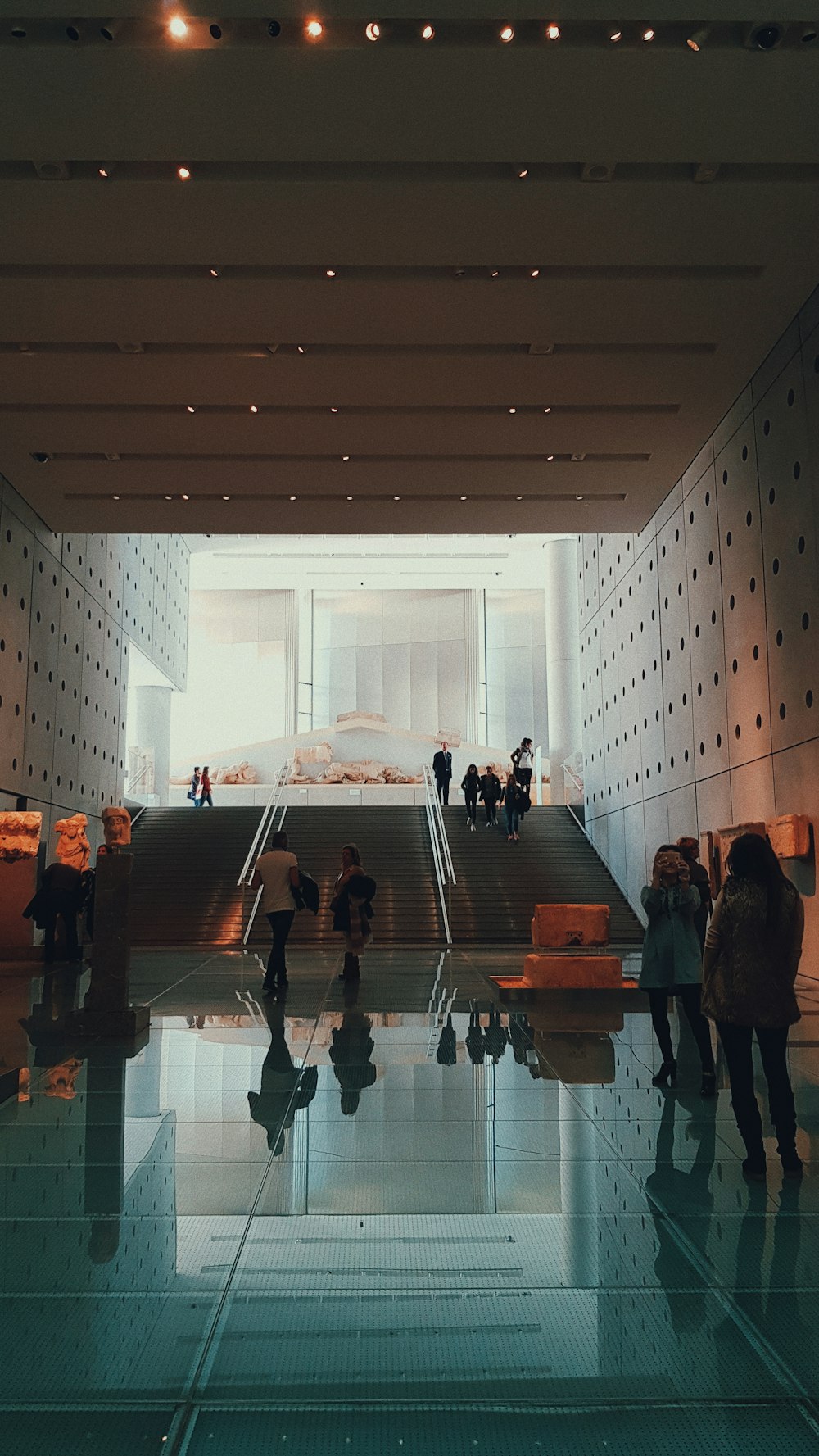 a group of people standing in a lobby