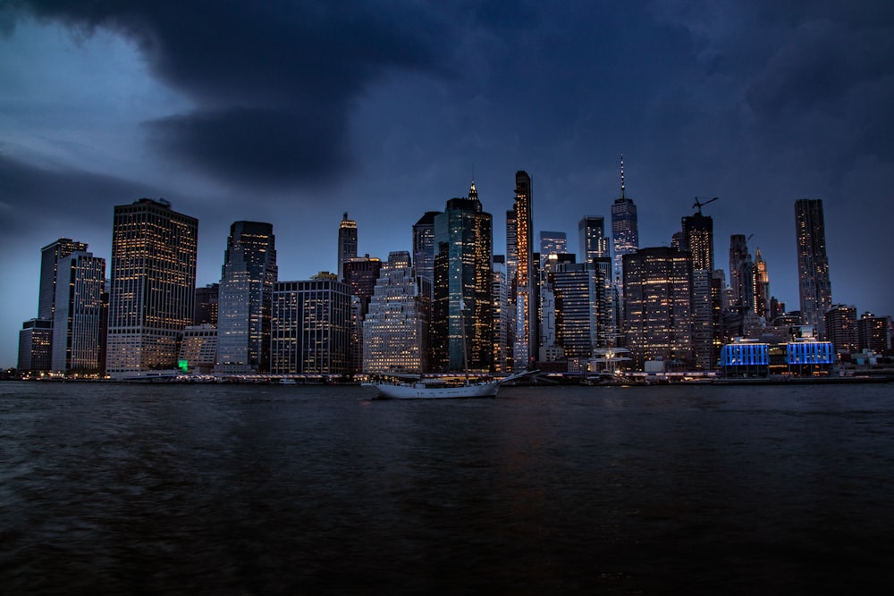 brown buildings near ocean during nighttime