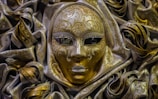 gold and white masquerade ball mask
