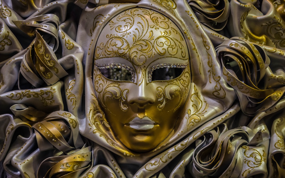 gold and white masquerade ball mask