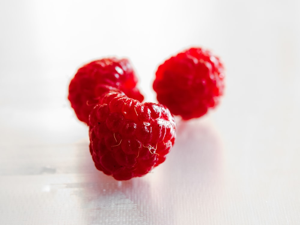 three red raspberries