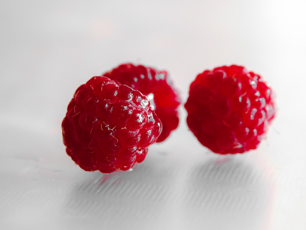 three red raspberries