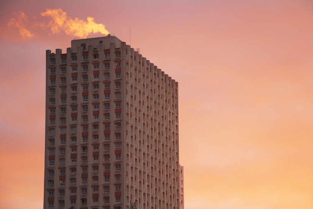 gray building under orange sky