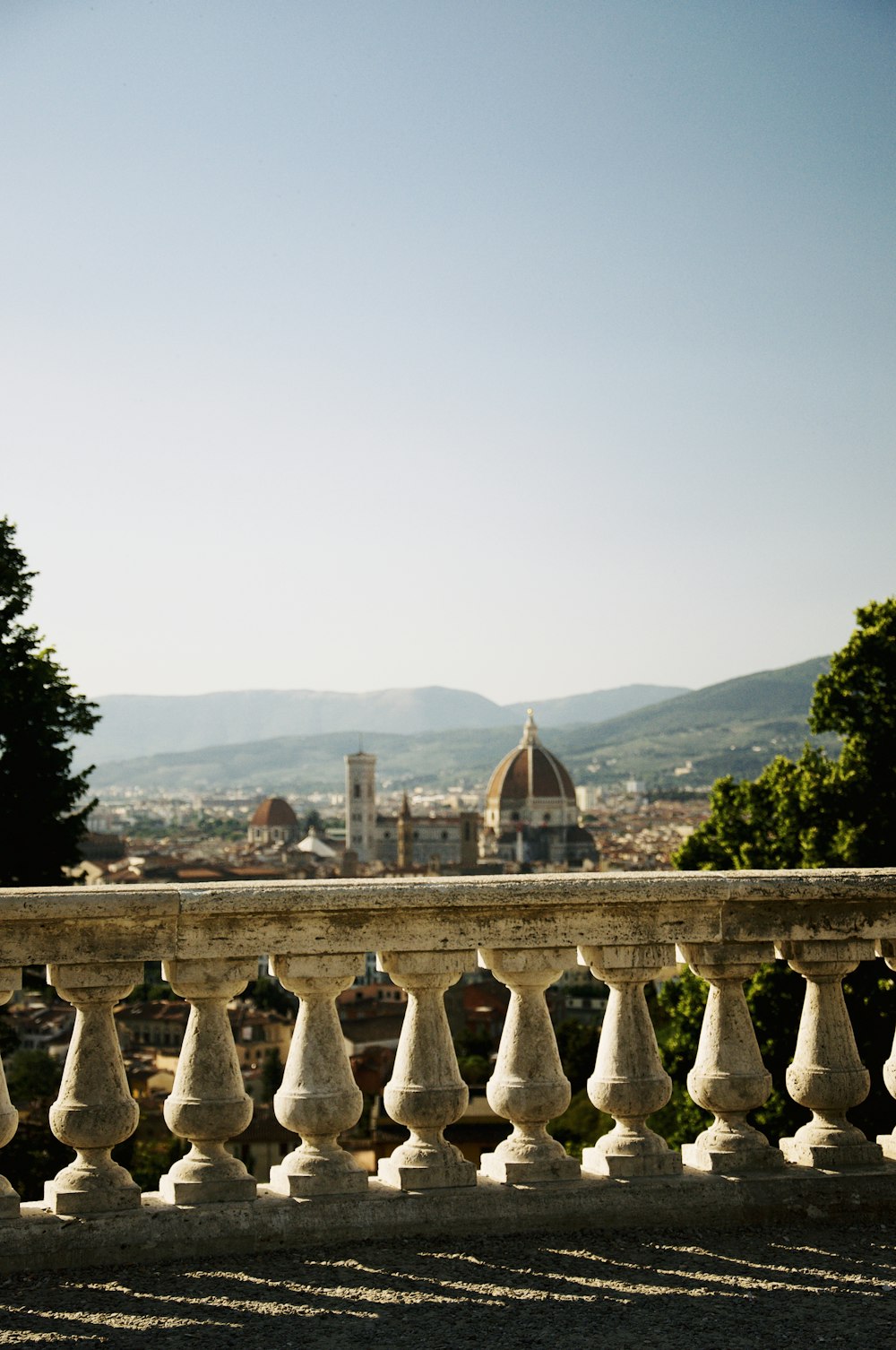 a balcony with a view of a city in the distance