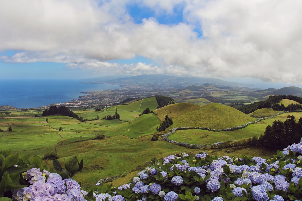 Faial Pico Azores — Pico volcano rising 2351m from the Atlantic Ocean seen across the channel from Faial island at sunrise