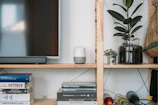 Smart home assistant device placed on a modern living room shelf