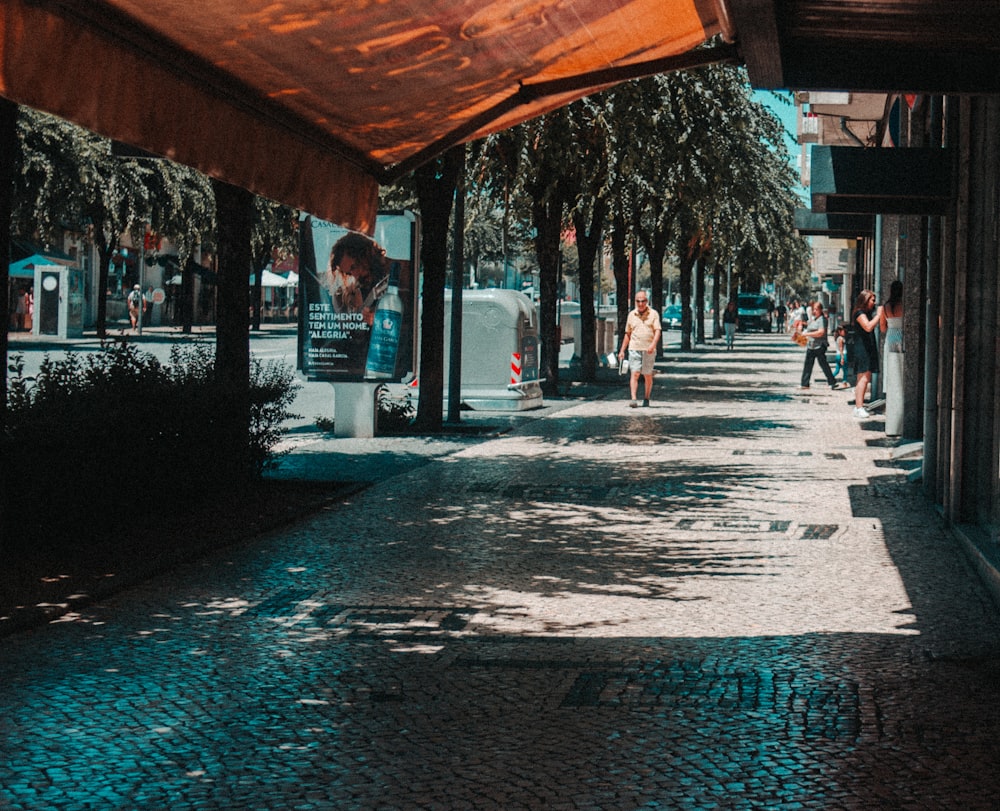 man walking in sidewalk