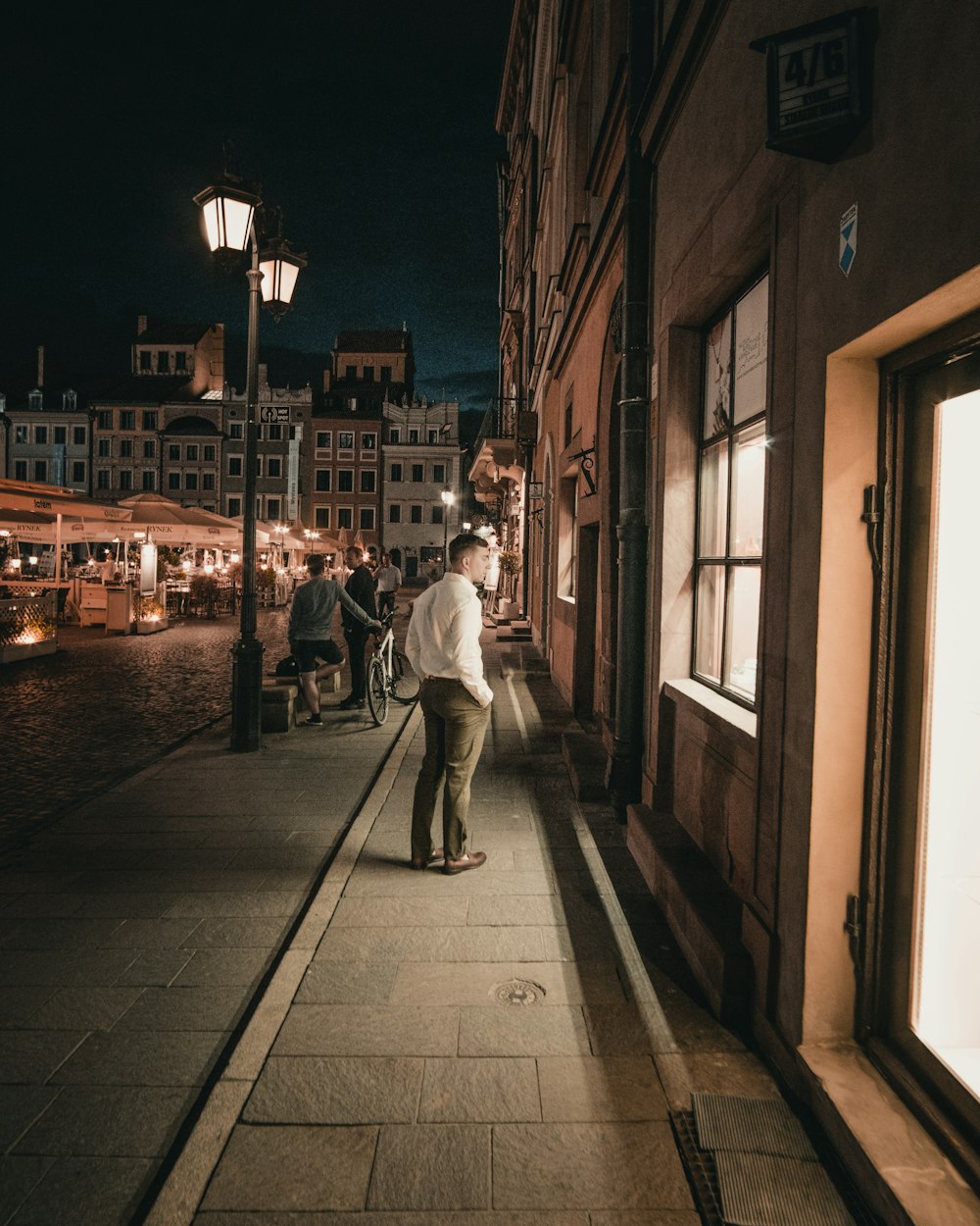 man standing and looking window