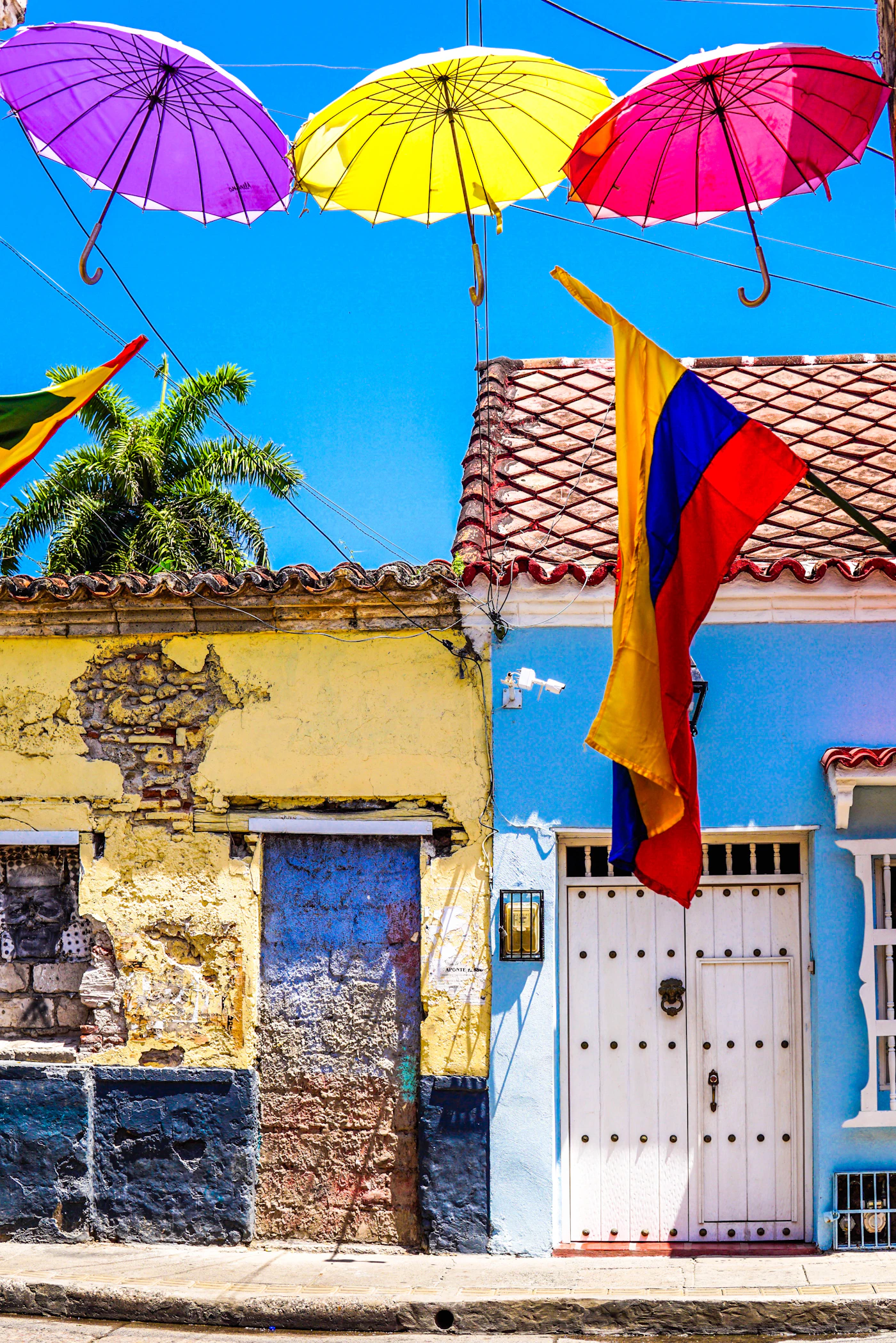 Cartagena interior courtyard of a colonial mansion with fountain, tropical plants, and afternoon light