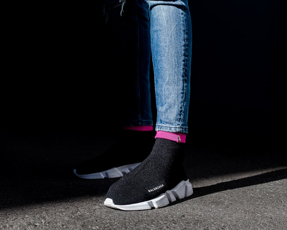 person wearing white-and-black Balenciaga Speed Trainer sneakers photo –  Free Image on Unsplash