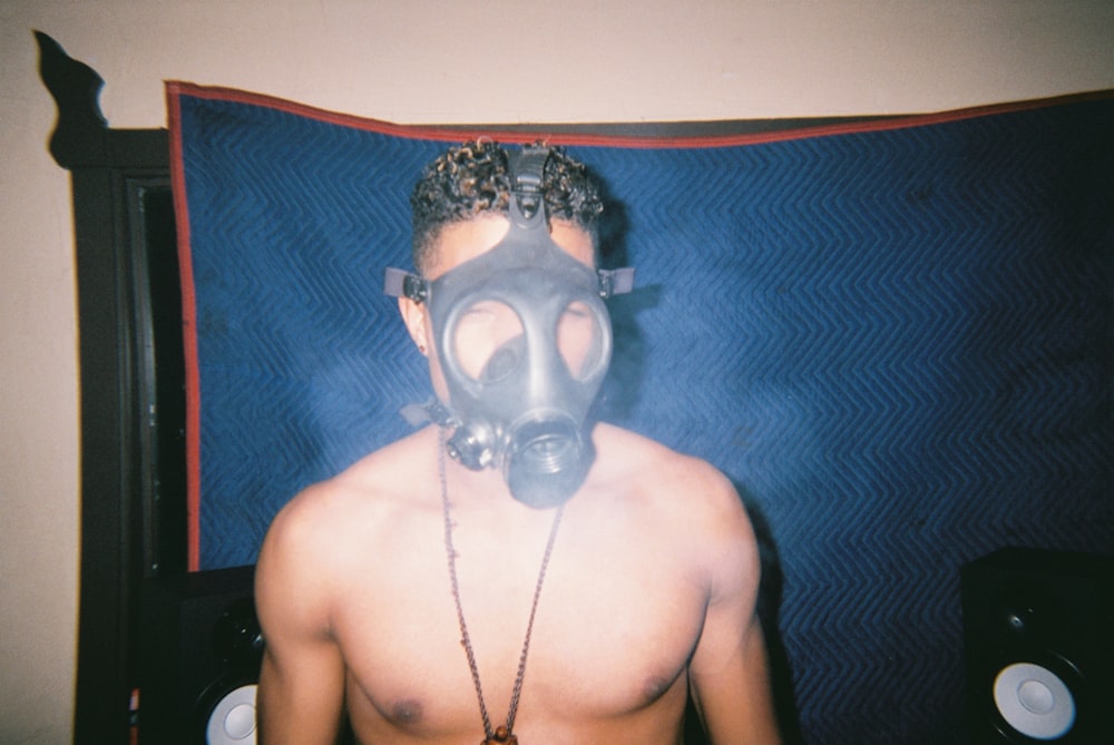 topless man wearing gas mask