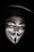 A stylized white mask with a goatee, resembling the Guy Fawkes mask, is depicted, framed dramatically by darkness. The mask features exaggerated facial features such as a wide smile and arched eyebrows, creating an enigmatic and mysterious aura. It is complemented by a dark wide-brimmed hat, adding to the sense of intrigue.