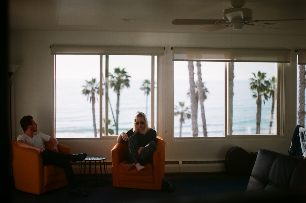 person sitting on sofa chair