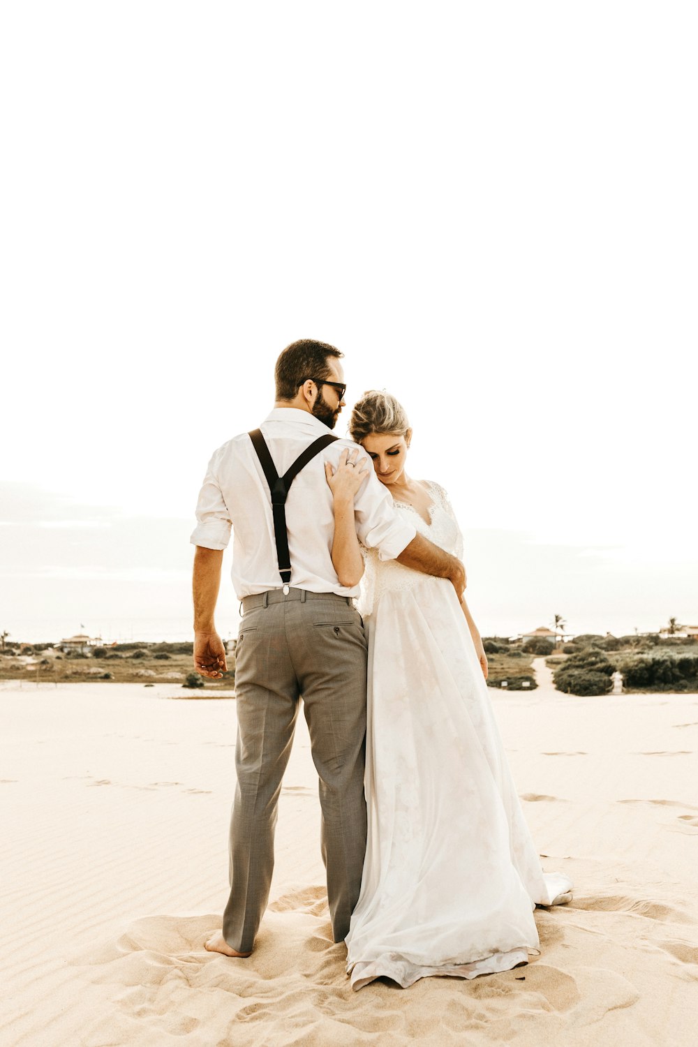 couple standing on shore