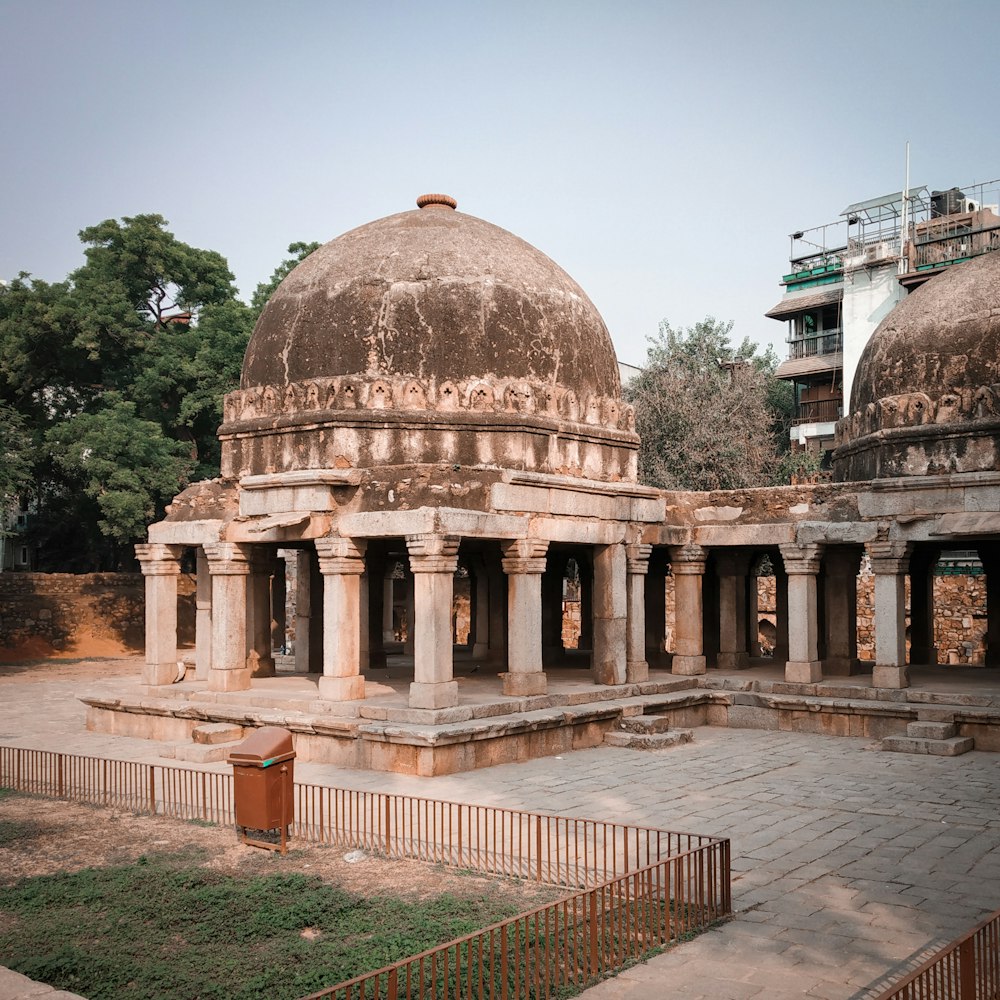 grey concrete domed building near green leafed tree