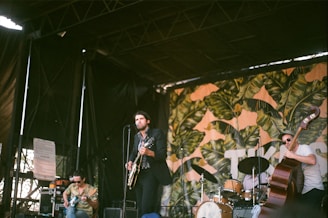 A lively salsa band performing on a tropical beach at sunset.