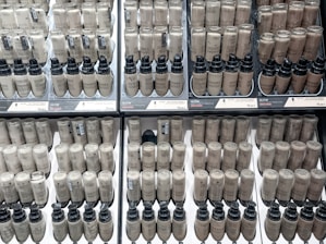 a display case filled with lots of brown and black items