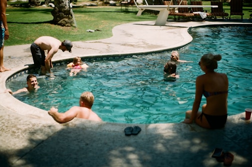 Round Rock family swimming in the pool after pool filter repair.