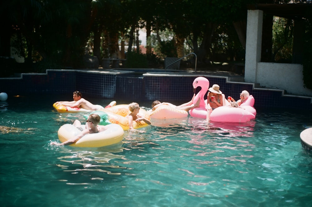 people swimming during daytime