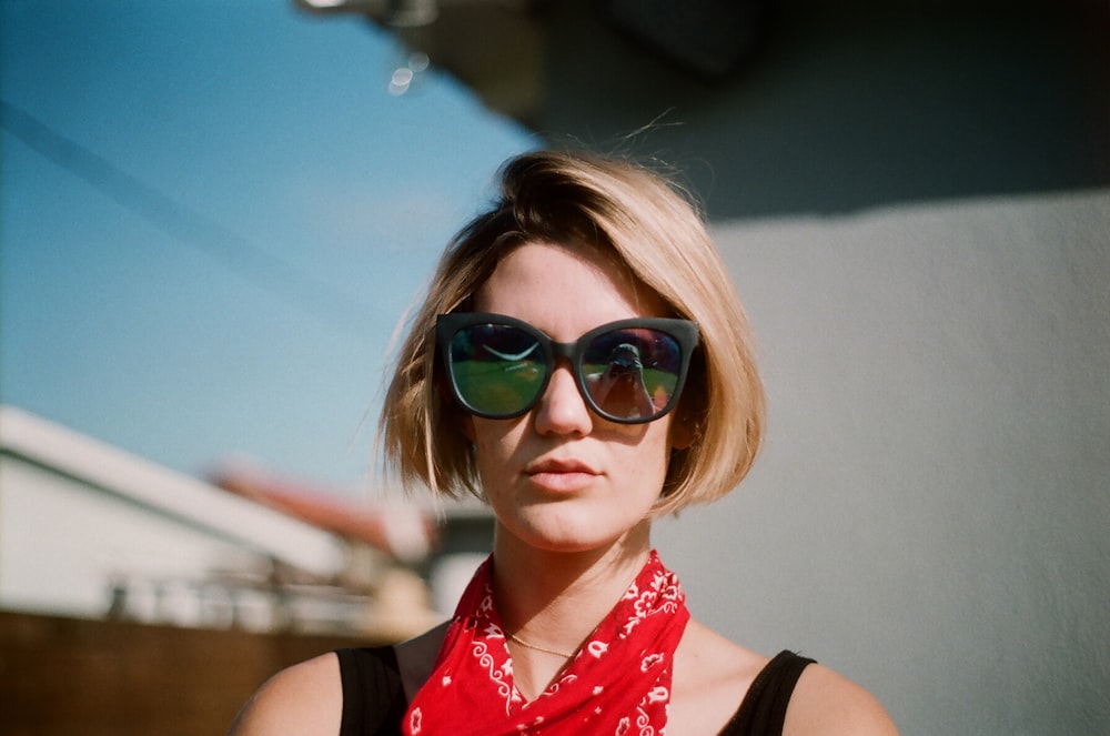 woman wearing sunglasses and scarf