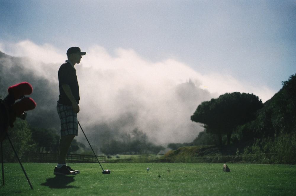 man playing golf during daytime
