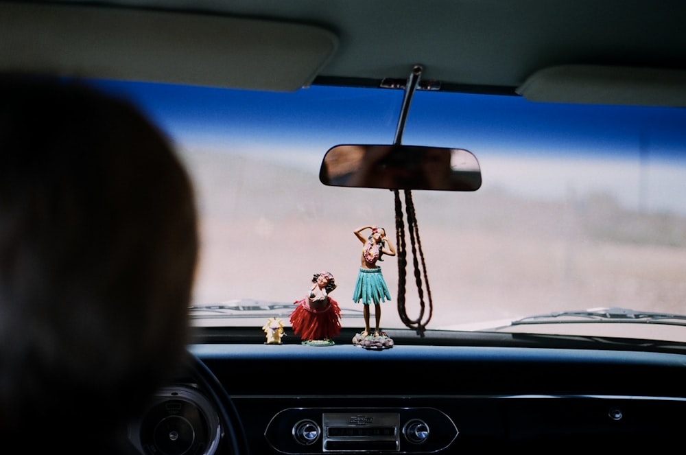 selective focus photography of Hawaiian girl figurine