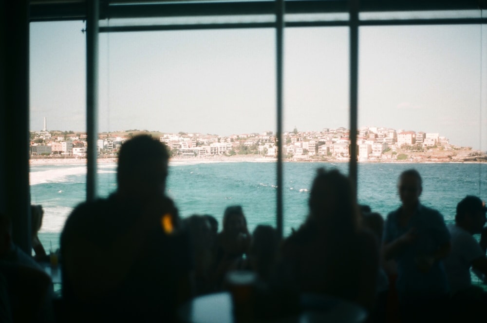 silhouette of people near glass wall