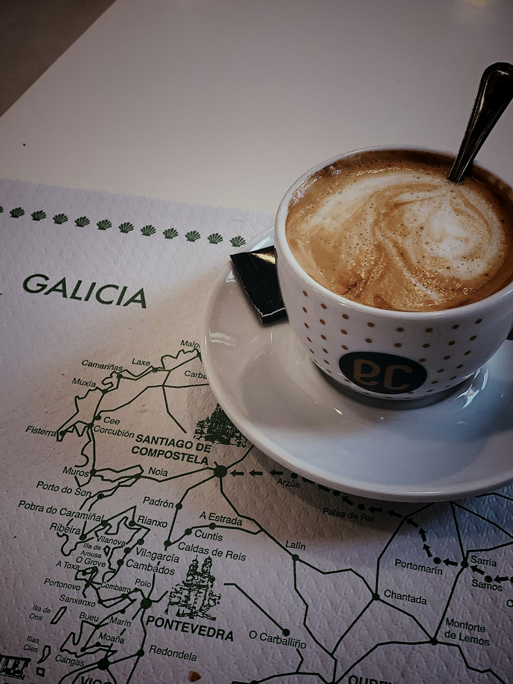 coffee latte in ceramic cup on saucer