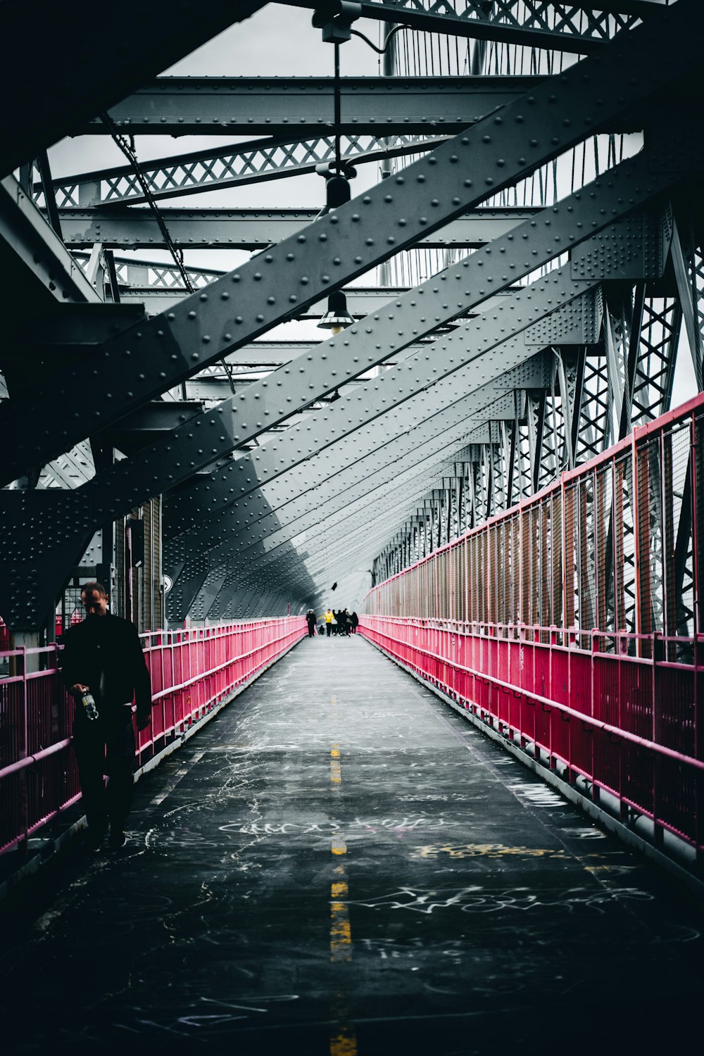 red and gray metal steel bridge