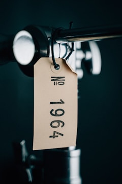 Close-up of a vintage item with a handwritten tag telling its story.