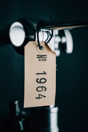 A unique serial number tag attached to a collectible item.